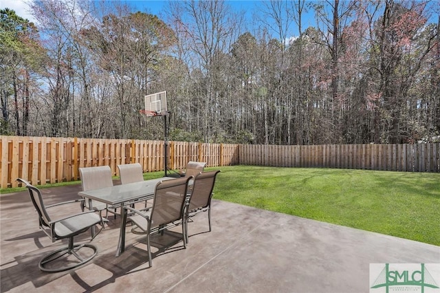 view of patio / terrace with a wall mounted AC, a fenced backyard, and outdoor dining space