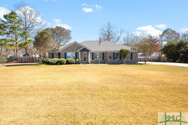 single story home with fence, a front lawn, and brick siding