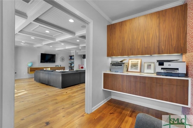 kitchen featuring coffered ceiling, brown cabinets, and hardwood / wood-style floors