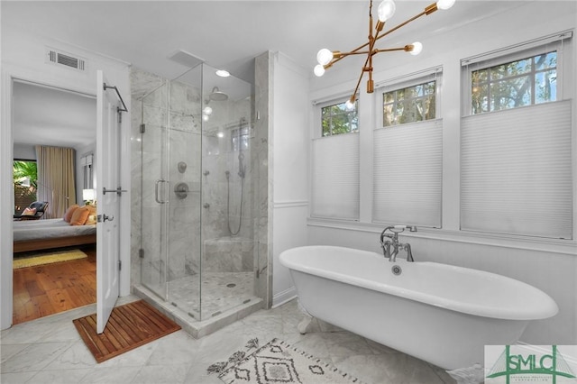 full bath featuring a stall shower, visible vents, a freestanding bath, and ensuite bathroom