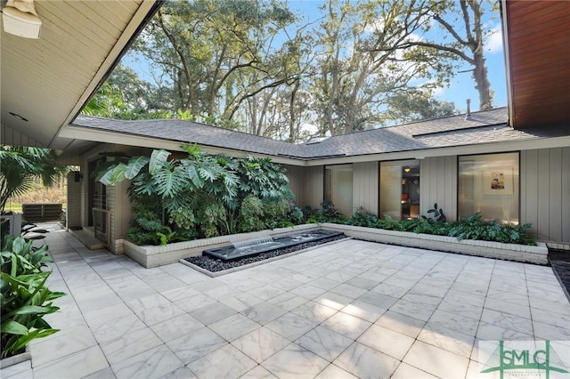 view of patio with a fire pit and central air condition unit