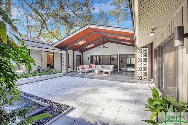 view of patio with an outdoor hangout area and a ceiling fan