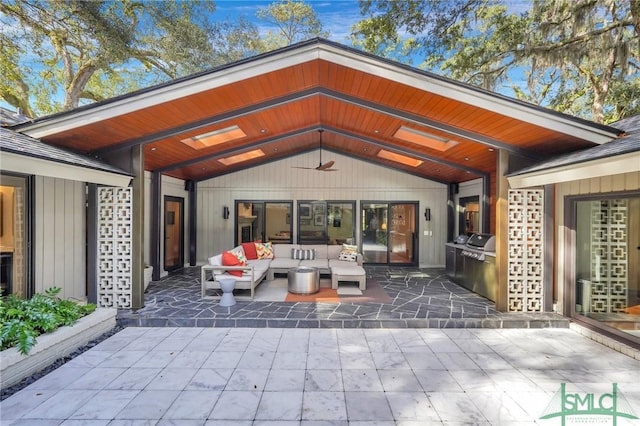 back of house with an outdoor hangout area and a patio