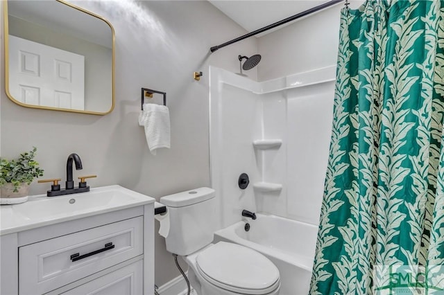 full bath with shower / tub combo, vanity, and toilet