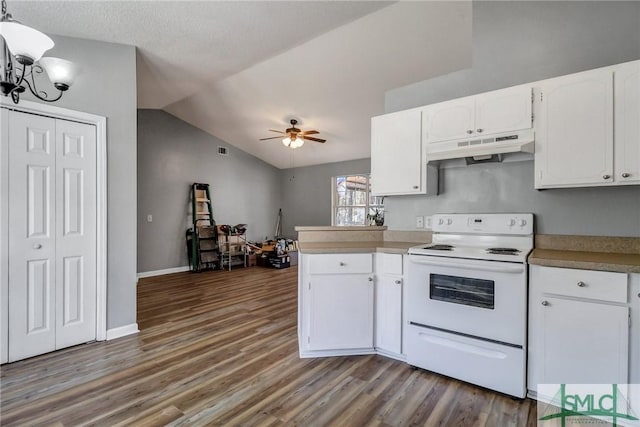 kitchen with lofted ceiling, under cabinet range hood, white cabinetry, and electric stove