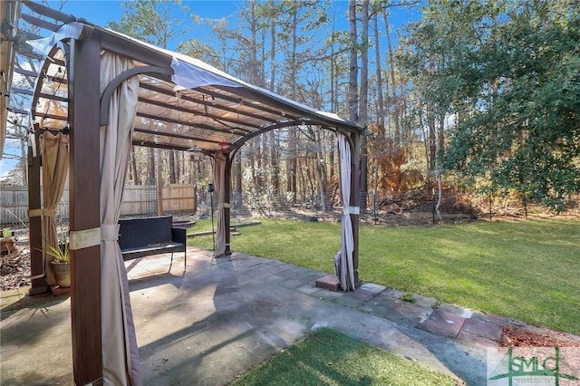 view of patio / terrace with fence and a pergola