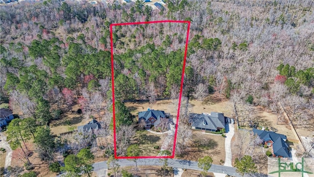 aerial view featuring a view of trees