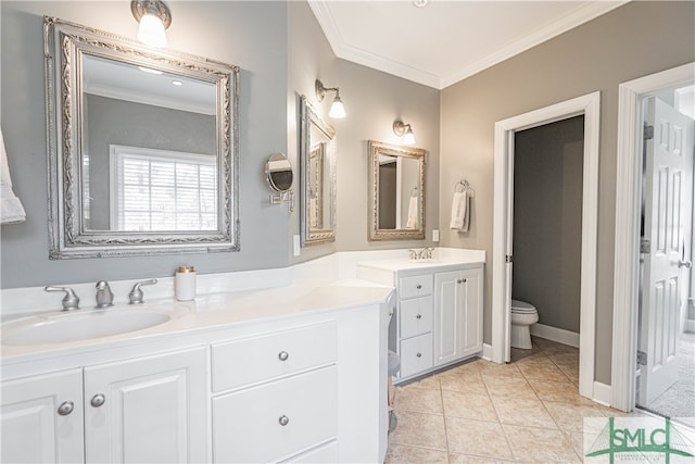 bathroom with tile patterned flooring, toilet, vanity, baseboards, and crown molding