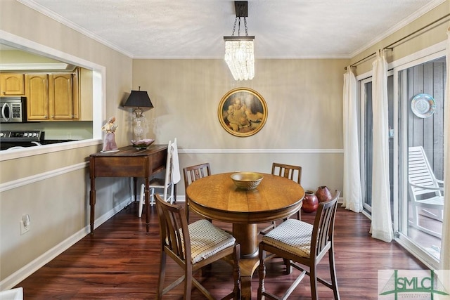 dining area with an inviting chandelier, crown molding, a wealth of natural light, and dark wood-type flooring