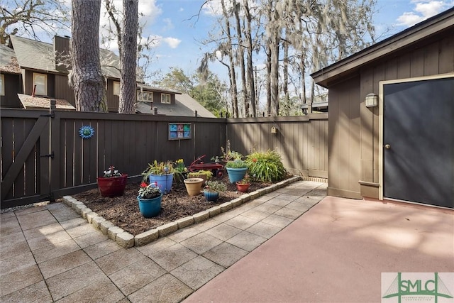 view of patio / terrace featuring a fenced backyard and a gate