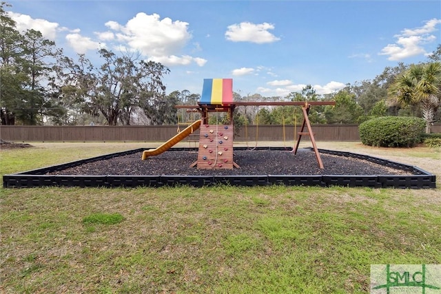 view of play area with a yard and fence