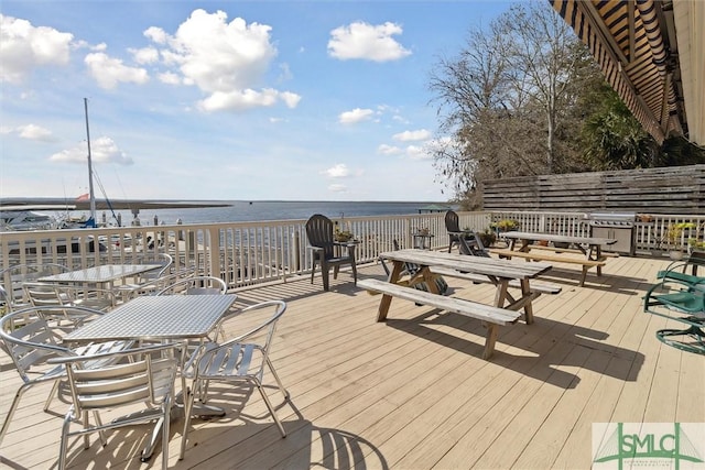 wooden deck featuring a water view