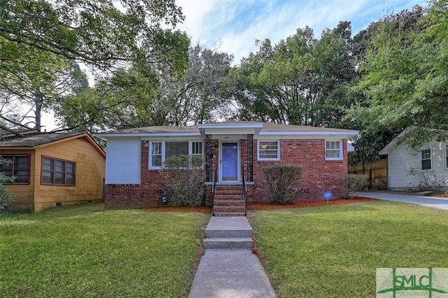 single story home featuring crawl space, brick siding, and a front lawn