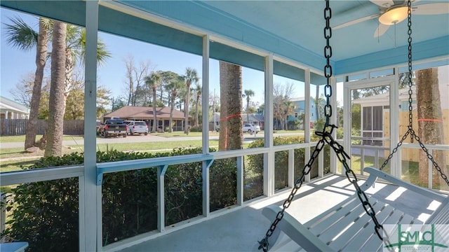 unfurnished sunroom with a residential view