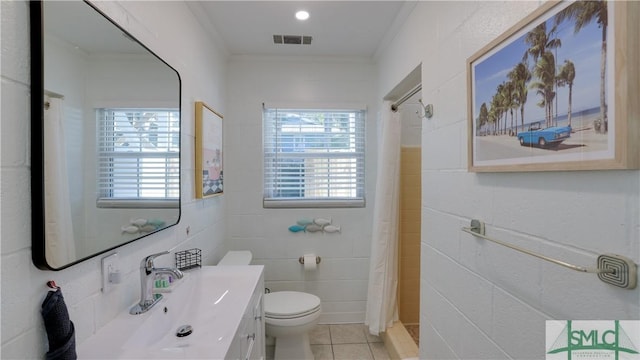 bathroom featuring visible vents, toilet, tile patterned floors, curtained shower, and vanity