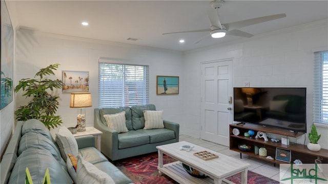 living room with crown molding, ceiling fan, recessed lighting, and tile patterned floors