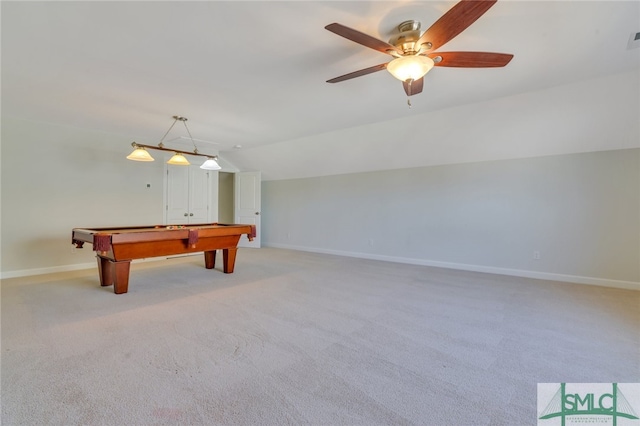 playroom featuring lofted ceiling, light carpet, and baseboards