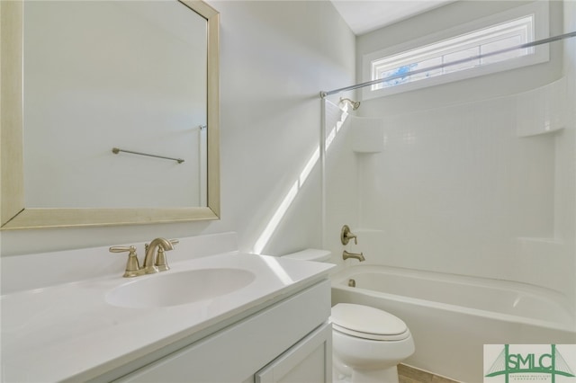 bathroom with toilet, bathtub / shower combination, and vanity