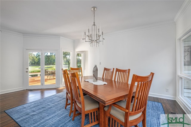 dining area with dark wood-style floors, baseboards, a notable chandelier, and ornamental molding