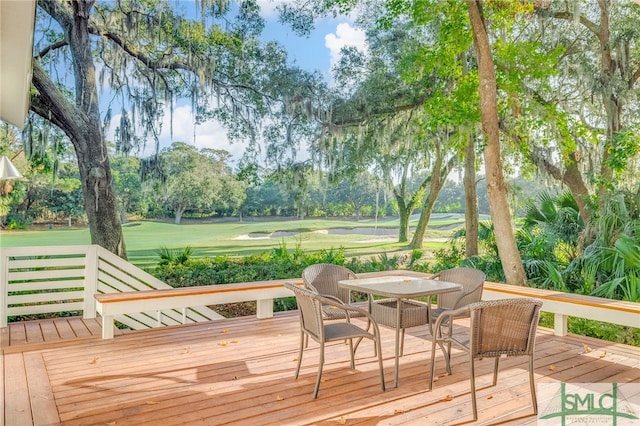 wooden terrace featuring outdoor dining space