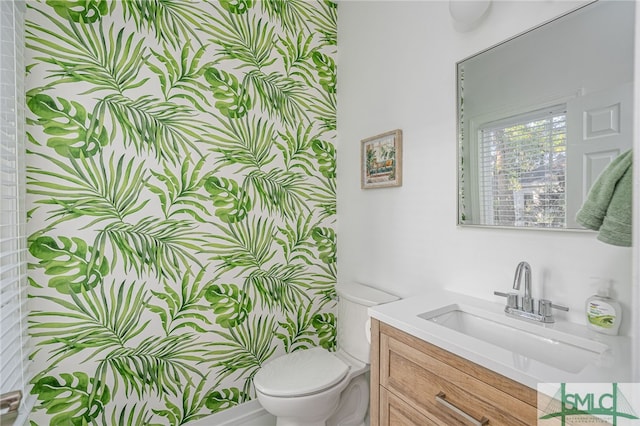 half bath with vanity and toilet