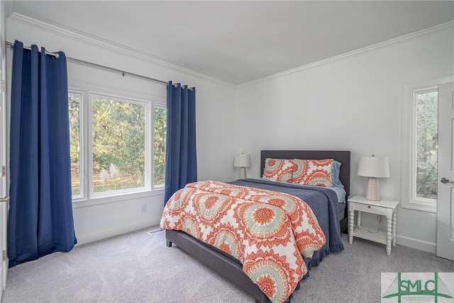 bedroom featuring baseboards, carpet floors, and ornamental molding