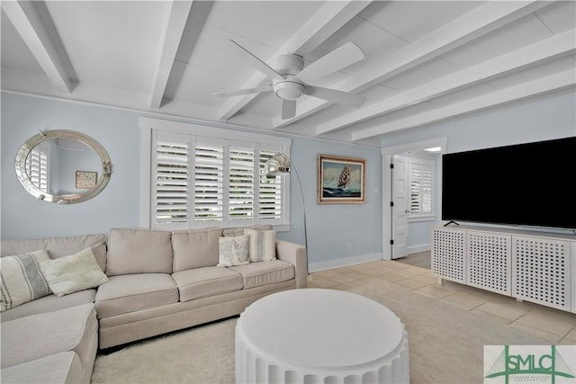 living room with light tile patterned floors, beamed ceiling, a ceiling fan, and baseboards