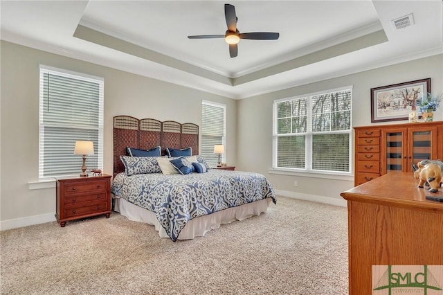 bedroom featuring baseboards, visible vents, a raised ceiling, and carpet flooring