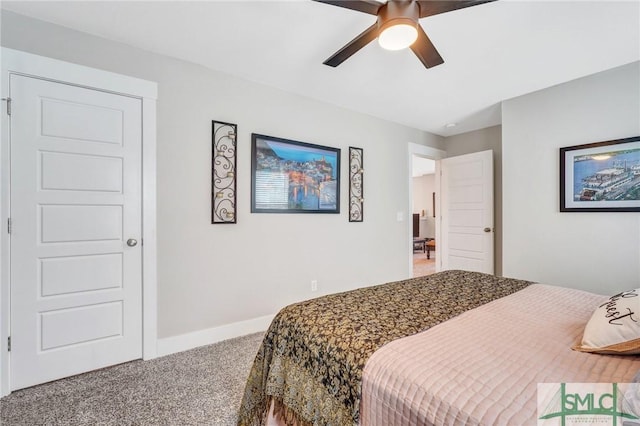 carpeted bedroom featuring ceiling fan and baseboards