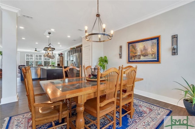 dining area featuring baseboards, crown molding, visible vents, and dark wood-type flooring