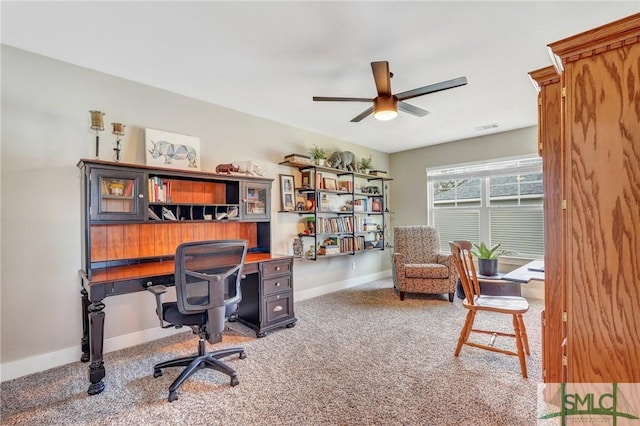 office area with a ceiling fan, carpet flooring, visible vents, and baseboards