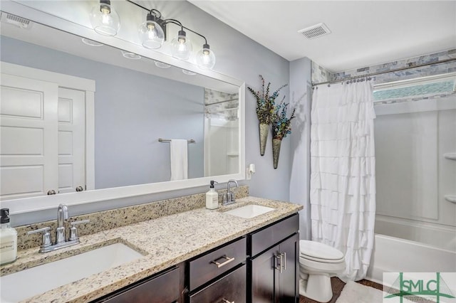 full bathroom featuring shower / bath combo, visible vents, and a sink