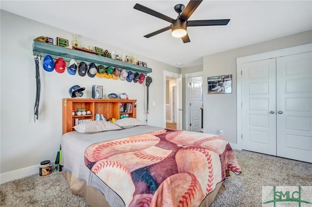 bedroom featuring ceiling fan, a closet, carpet flooring, and baseboards