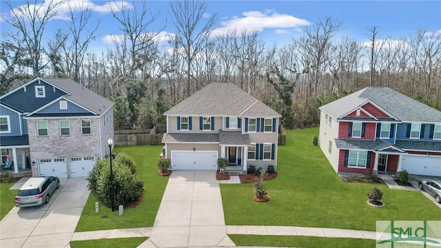 traditional-style house with driveway, roof with shingles, an attached garage, and a front yard