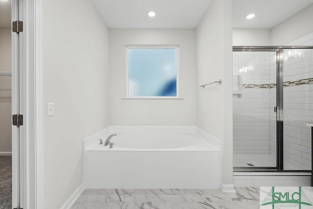 full bath featuring marble finish floor, a shower stall, a bath, and baseboards