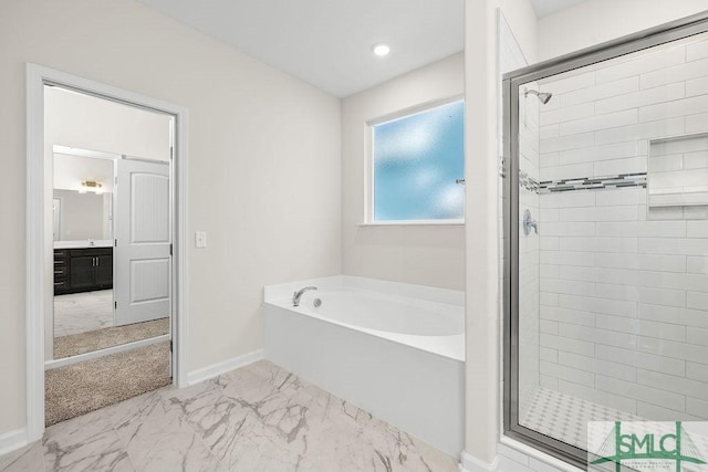 bathroom with a garden tub, vanity, baseboards, marble finish floor, and a stall shower