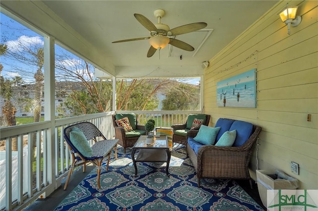 sunroom with ceiling fan and a healthy amount of sunlight