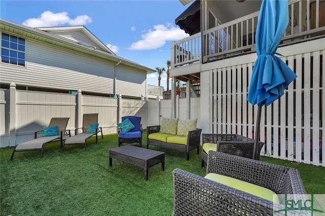 view of patio / terrace with outdoor lounge area and fence