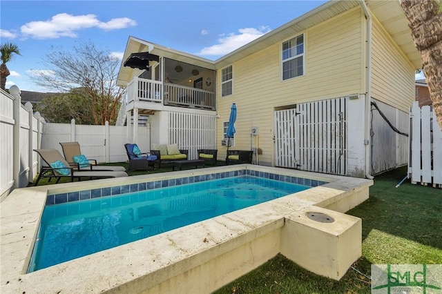 view of swimming pool with a fenced backyard, a fenced in pool, and a patio