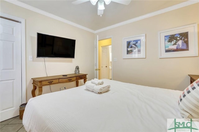 tiled bedroom featuring ceiling fan and ornamental molding