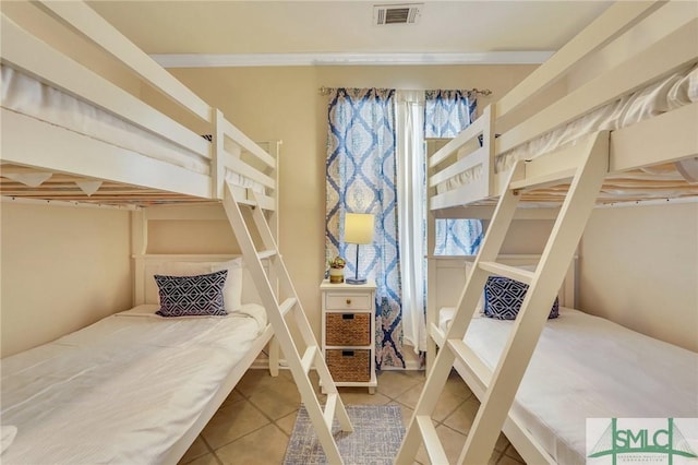 tiled bedroom featuring visible vents