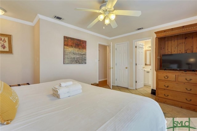 bedroom with connected bathroom, visible vents, crown molding, and light tile patterned flooring