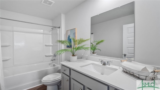 full bath featuring shower / bath combination, visible vents, vanity, and toilet