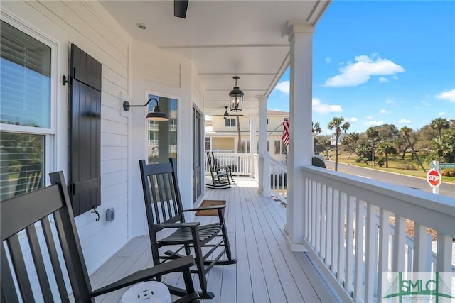 wooden terrace featuring a porch