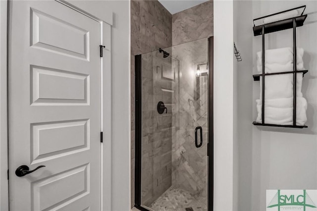 bathroom with a shower stall