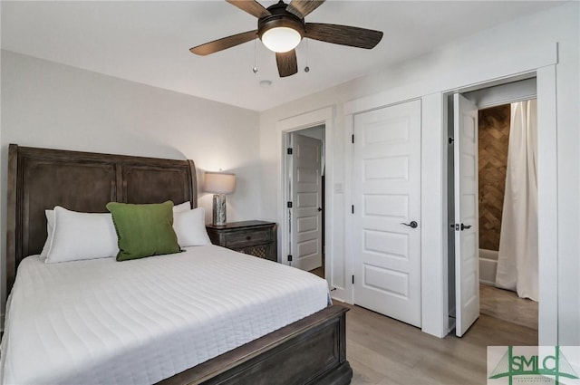 bedroom featuring light wood-type flooring and ceiling fan