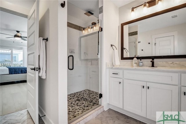 ensuite bathroom with a stall shower, visible vents, ensuite bathroom, marble finish floor, and vanity