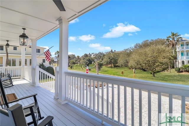 deck featuring a lawn