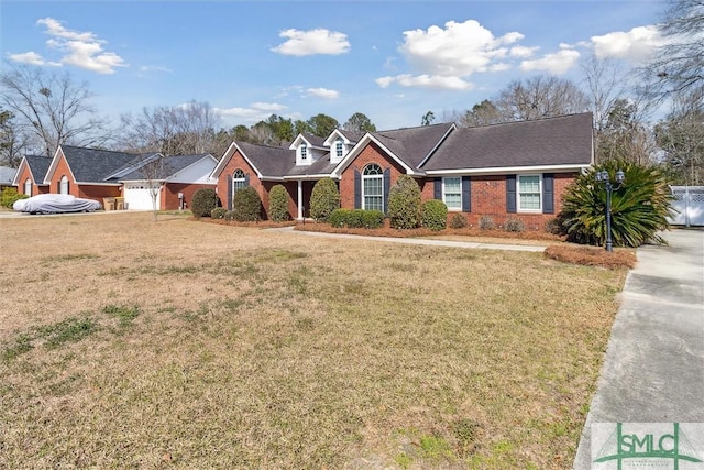 view of front of house with a front lawn and brick siding