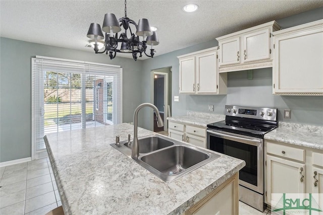 kitchen with a center island with sink, light countertops, electric range, a sink, and a textured ceiling